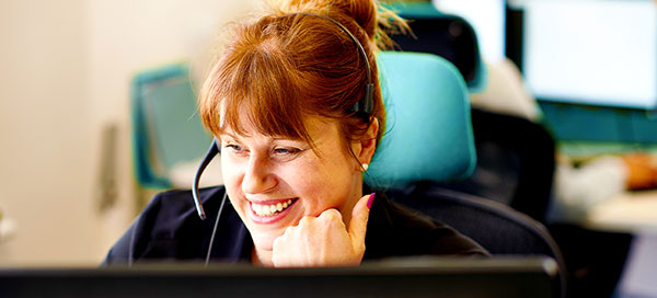 Smiling call centre employee