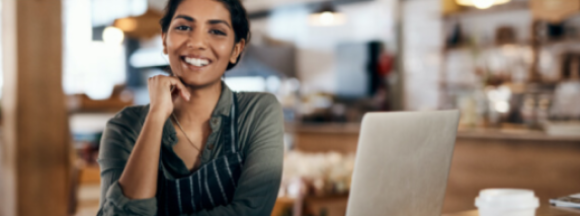 Smiling woman in her shop