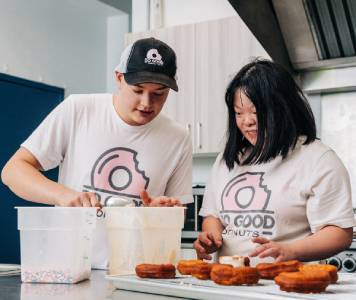 Two Do Good Donuts employees in the kitchen