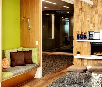 A sofa, chair, and gas fireplace at the corporate Meridian office in Toronto