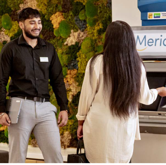 A Meridian branch employee assists a Member at the ABM