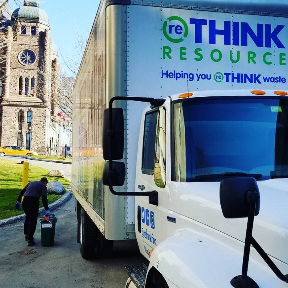 A large white industrial truck bearing the Rethink Resource logo.