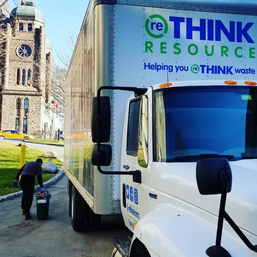 A large white industrial truck bearing the Rethink Resource logo.
